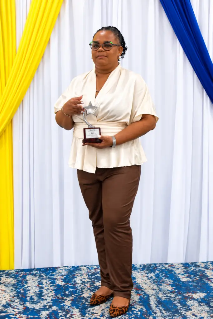 Miss Stacey Barrett with the Star Administrator of the Year award.